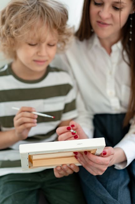 A child and adult collaborating on a painting project indoors, fostering creativity and learning.